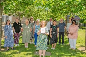 Volunteers and council staff with the award for supporting volunteering