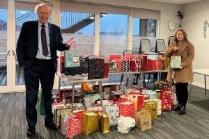 Council Leader and Depute Leader with gift bags 