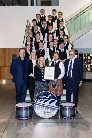 The band with Provost Cathy Muldoon. 