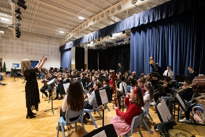 Young musicians performing as part of ensemble