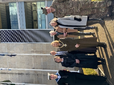 Group picture in front of Commonwealth day flag